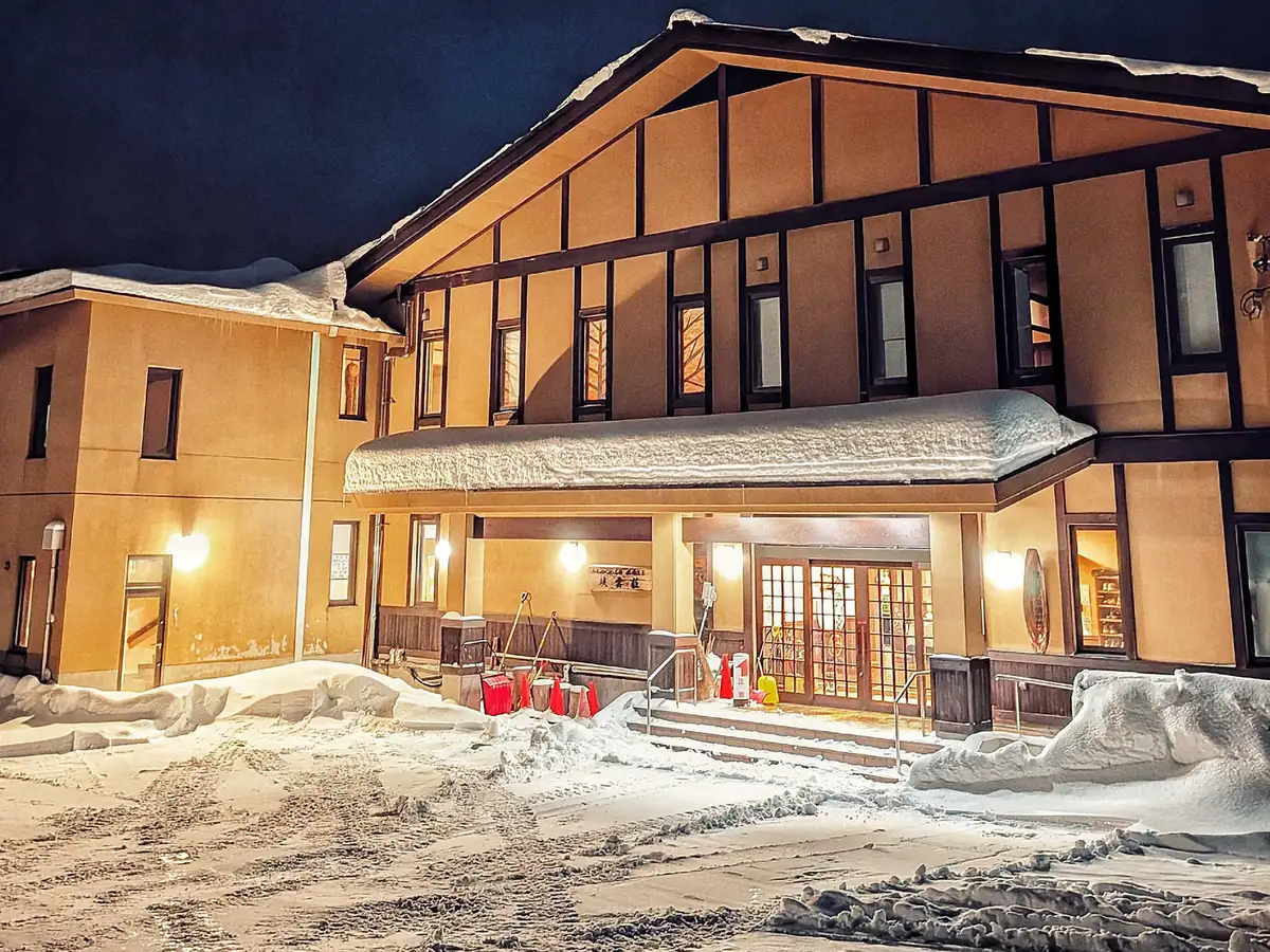 Kyounso's entrance lit up on a deep winter night